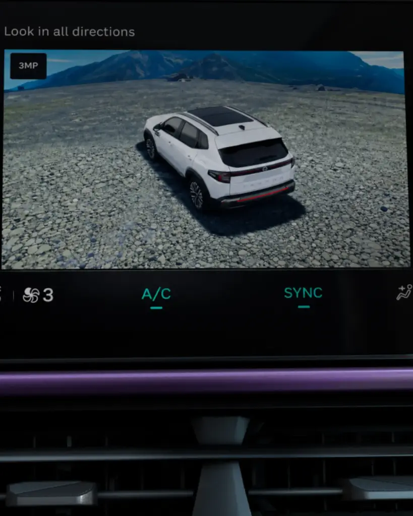 White SUV parked on a rocky plain with distant mountains; on-screen text says 'Look in all directions'.