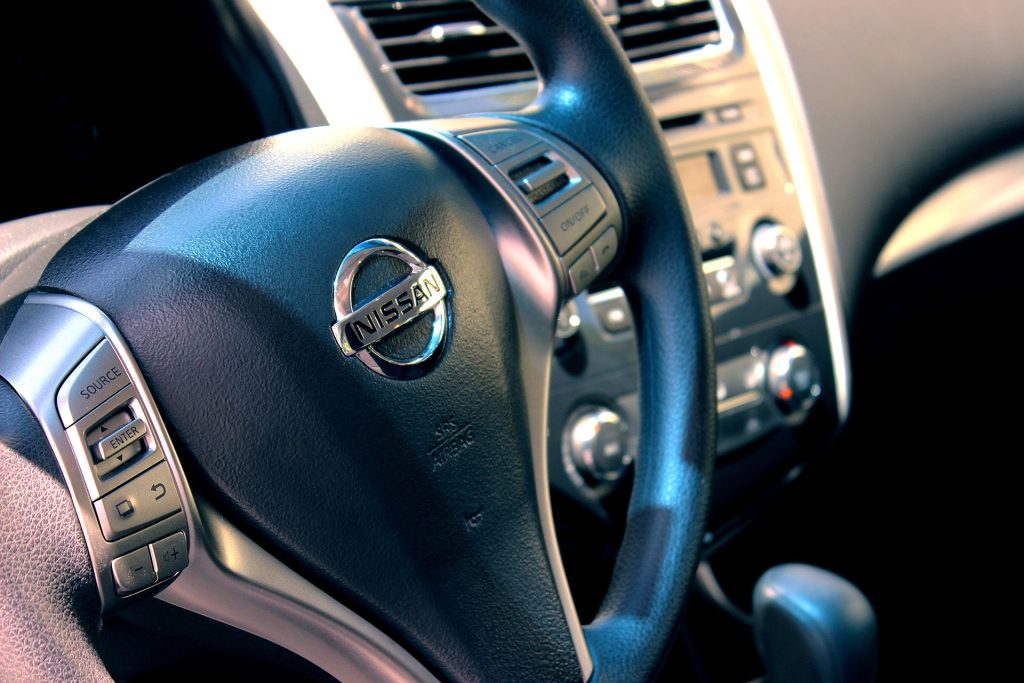 Steering wheel and centre console of a Nissan car