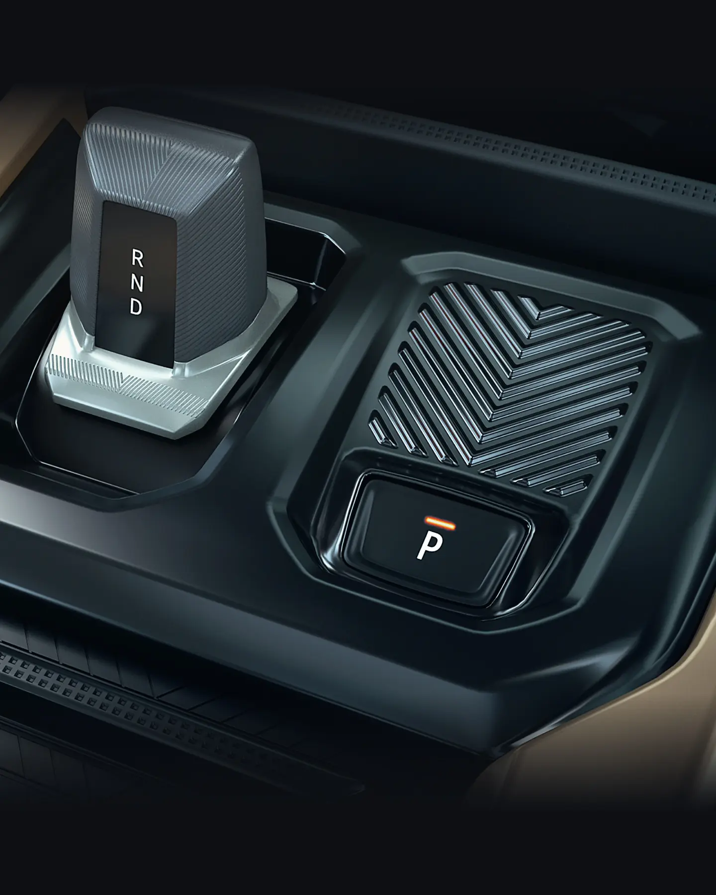 Gear selector panel showing R, N, D letters beside the parking brake in a modern car interior